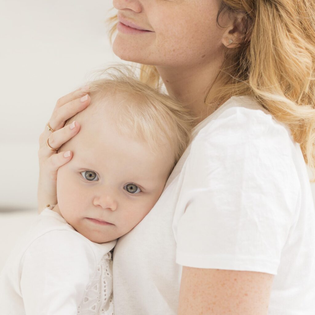 adorable baby girl together with mother